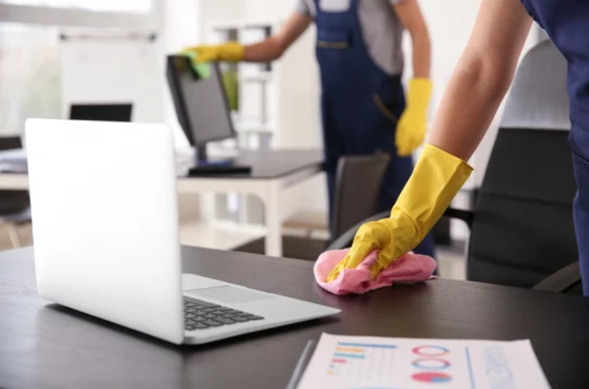 Janitorial staff cleaning offices